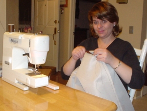Laura sewing the changing table pad for Nate.