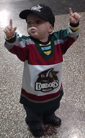 Nate at the Bakersfield Condors game Saturday night. He was standing in the lobby of the arena pointing to the ceiling. Everyone who walked by looked to see what he was pointing at. We couldn't see anything up there, but it was funny to watch everyone look up.