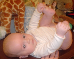 Nate holding his toes.
