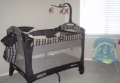 THE TRAVEL CRIB AND SLEEPER THAT WERE GIVEN TO US BY MY COWORKERS