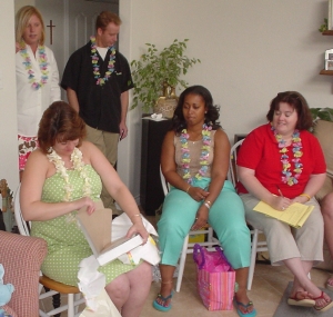 Opening gifts at the baby shower